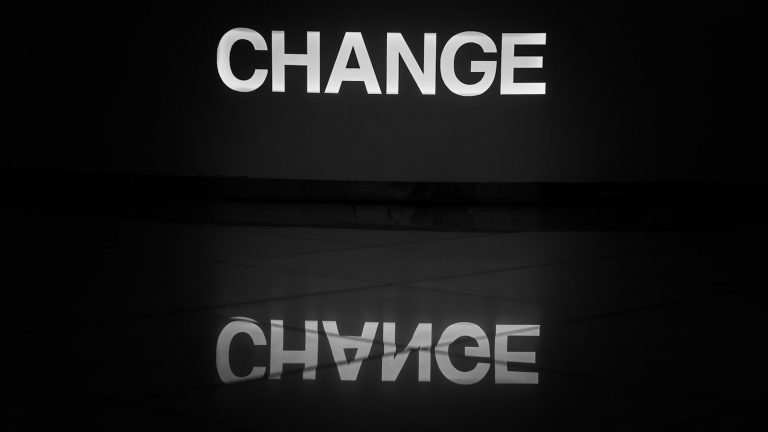 a black and white photo of the word change