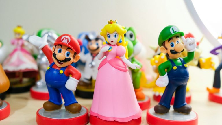 Mario, Luigi, and Princess Peach figurines